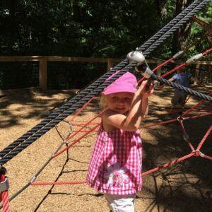 Lucy climbing The Spider Web at the Nature Center