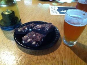 Hot chewy brownies with beer. Dark City Deli