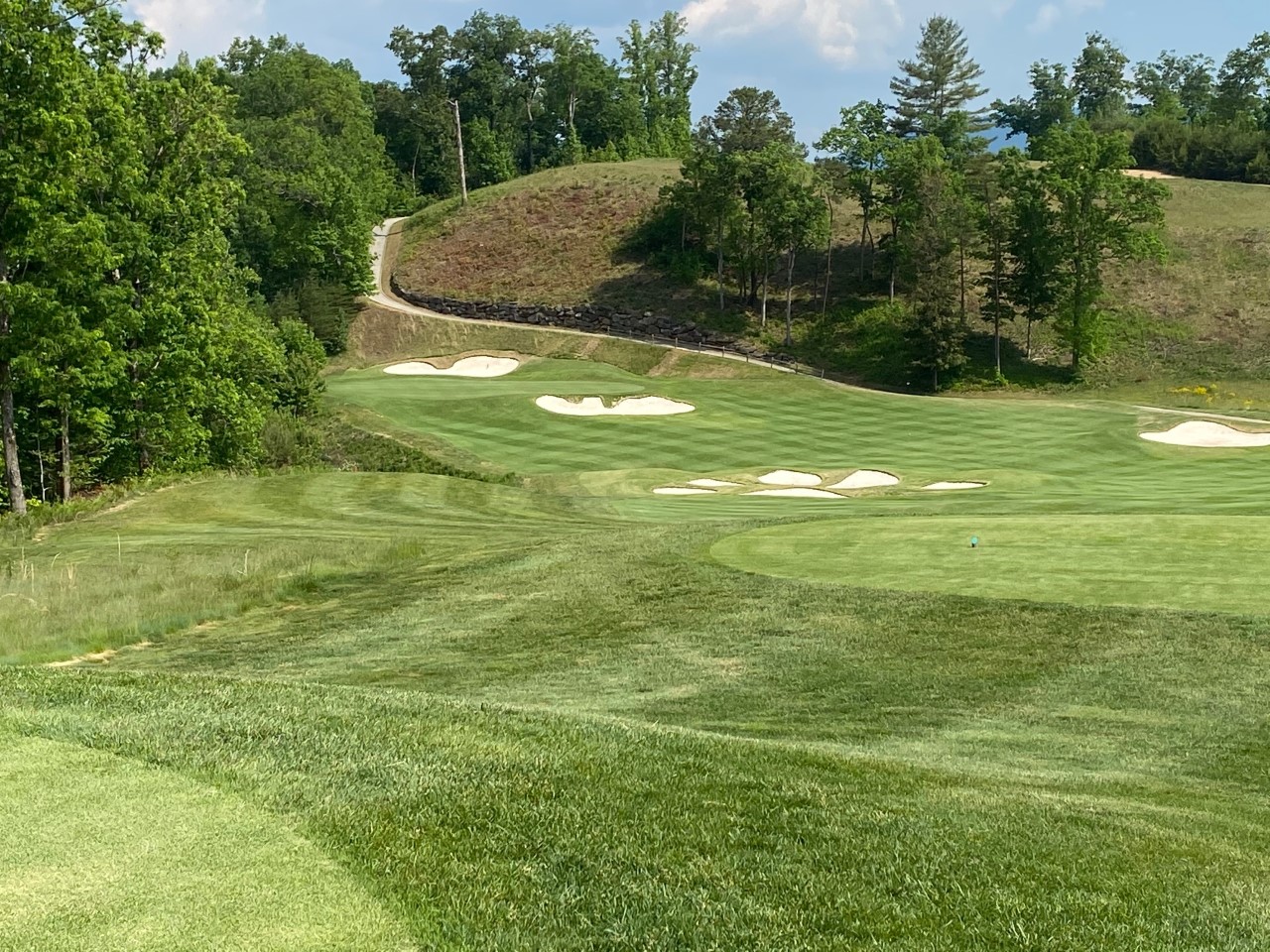 No. 18 downhill par-4 see bears paw bunkers