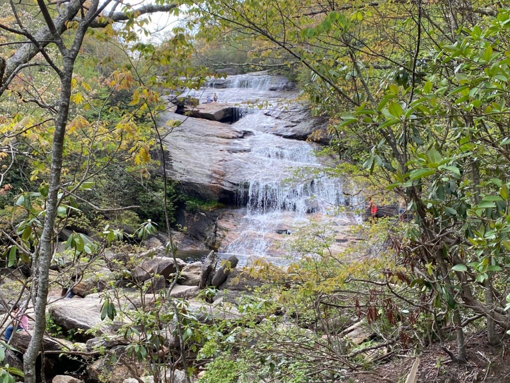 Lower Falls Graveyard Fields - Teen in red swimsuit preparing to take the leap.