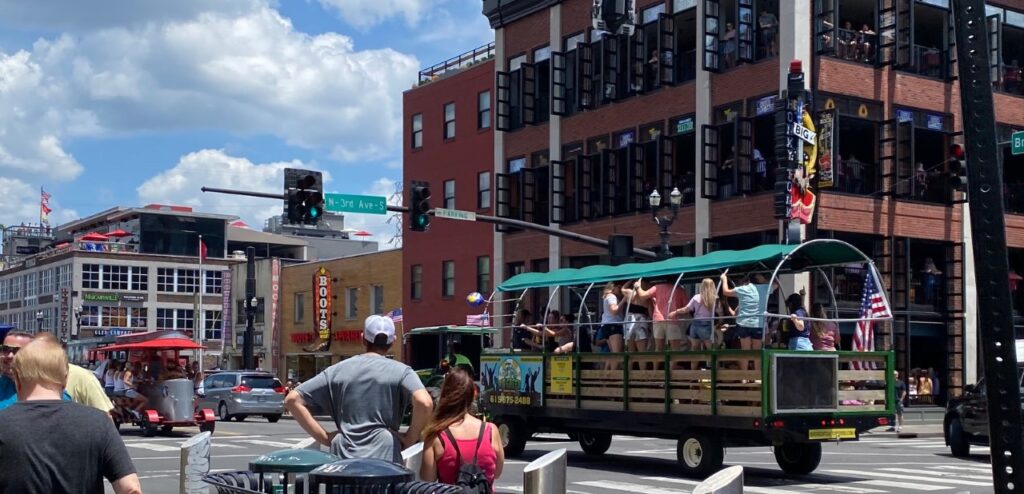 A pedal bar and a tractor pulling a party wagon