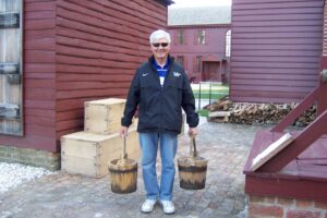 Richard Hauling water for laundry