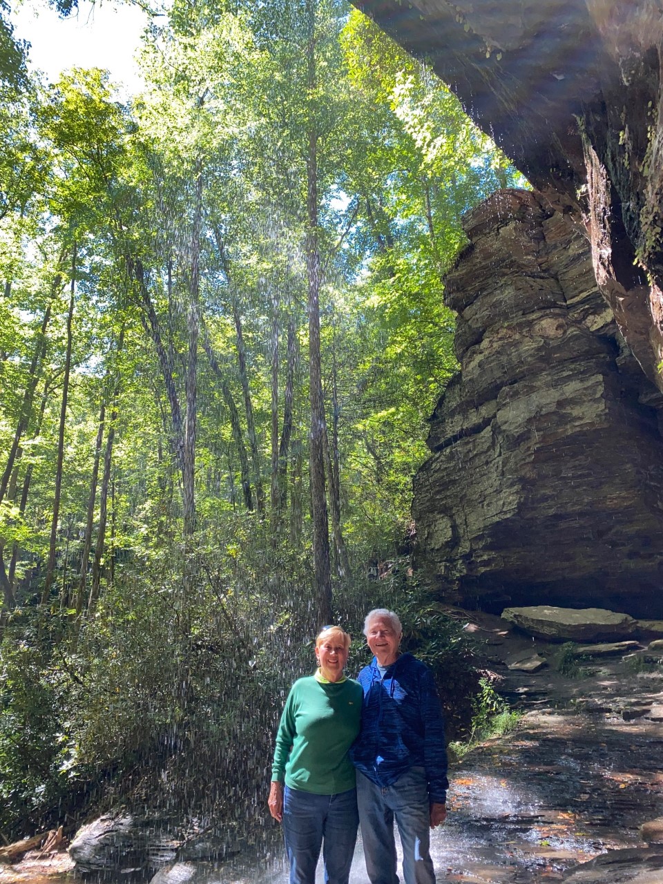 Inside the Grotto at Moore Cove Falls with waterfall behind us.