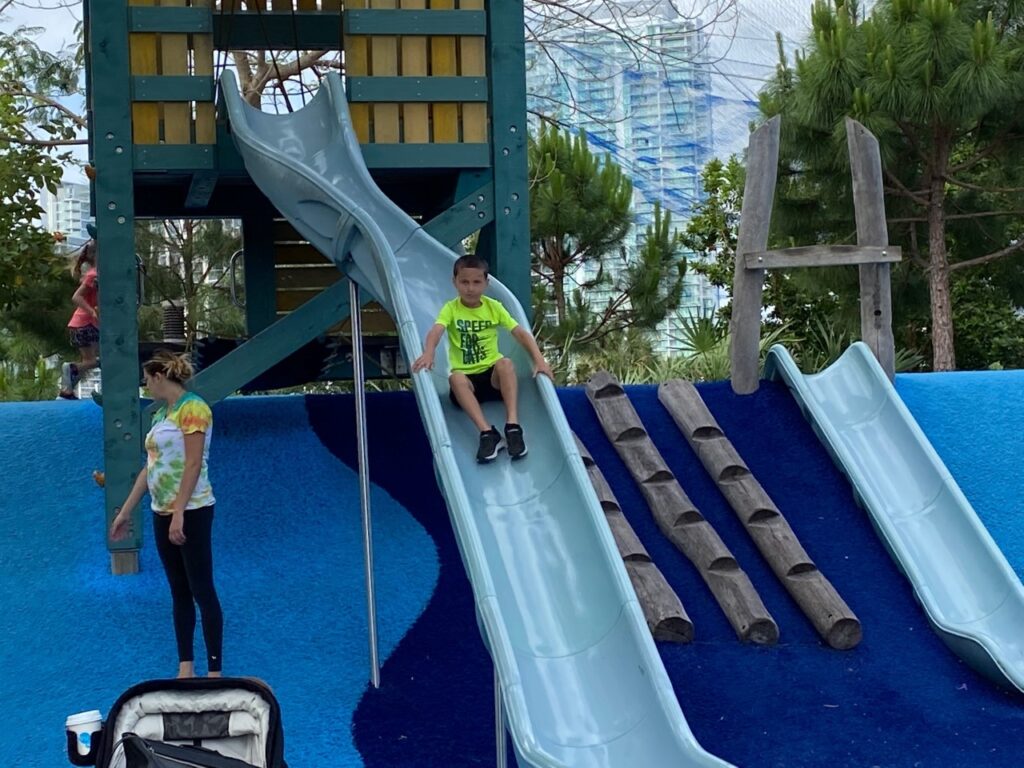 Hurrah! Keaton enjoys the slide.