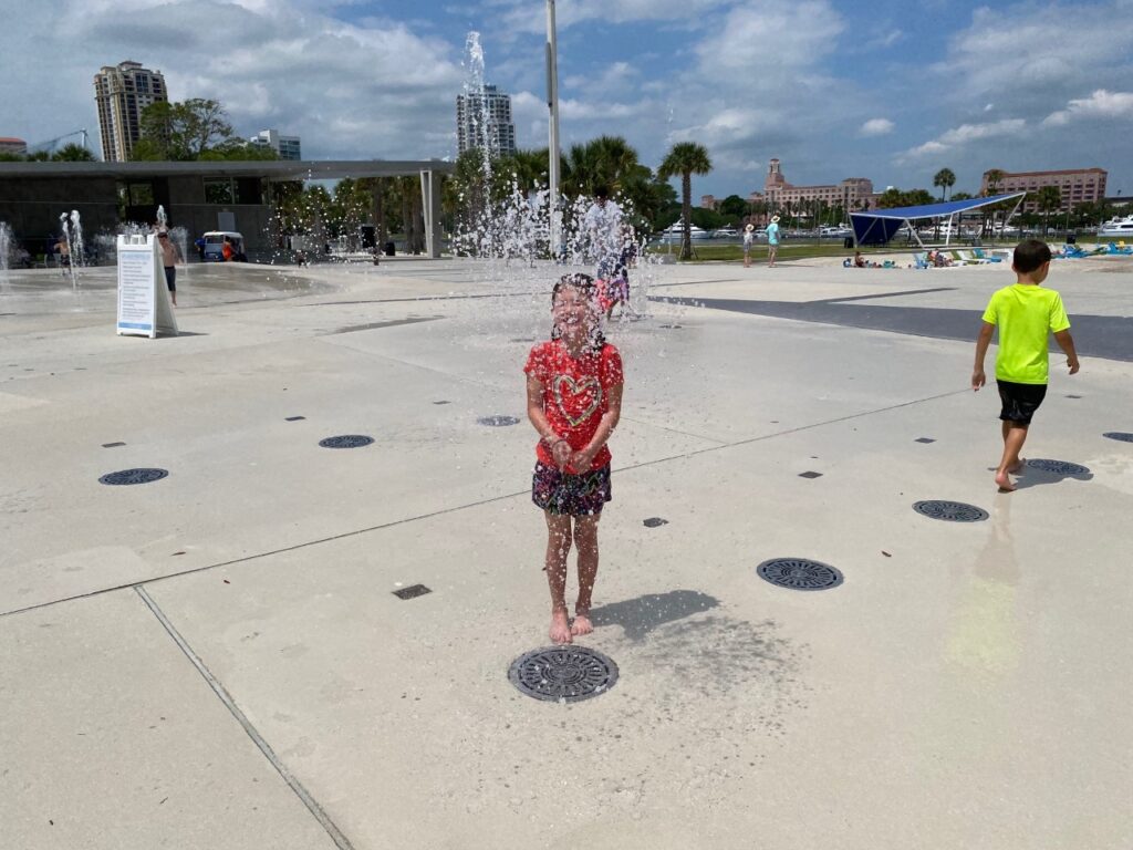 Kaia rinses off in the Splash Pad