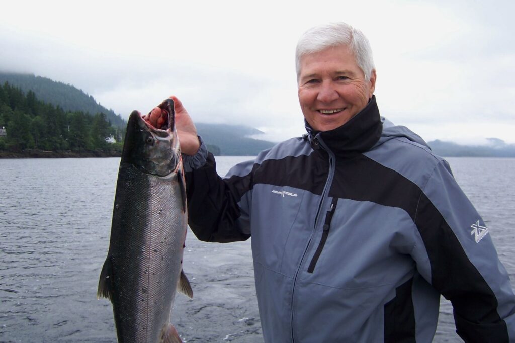 Richard smiles with his first salmon!