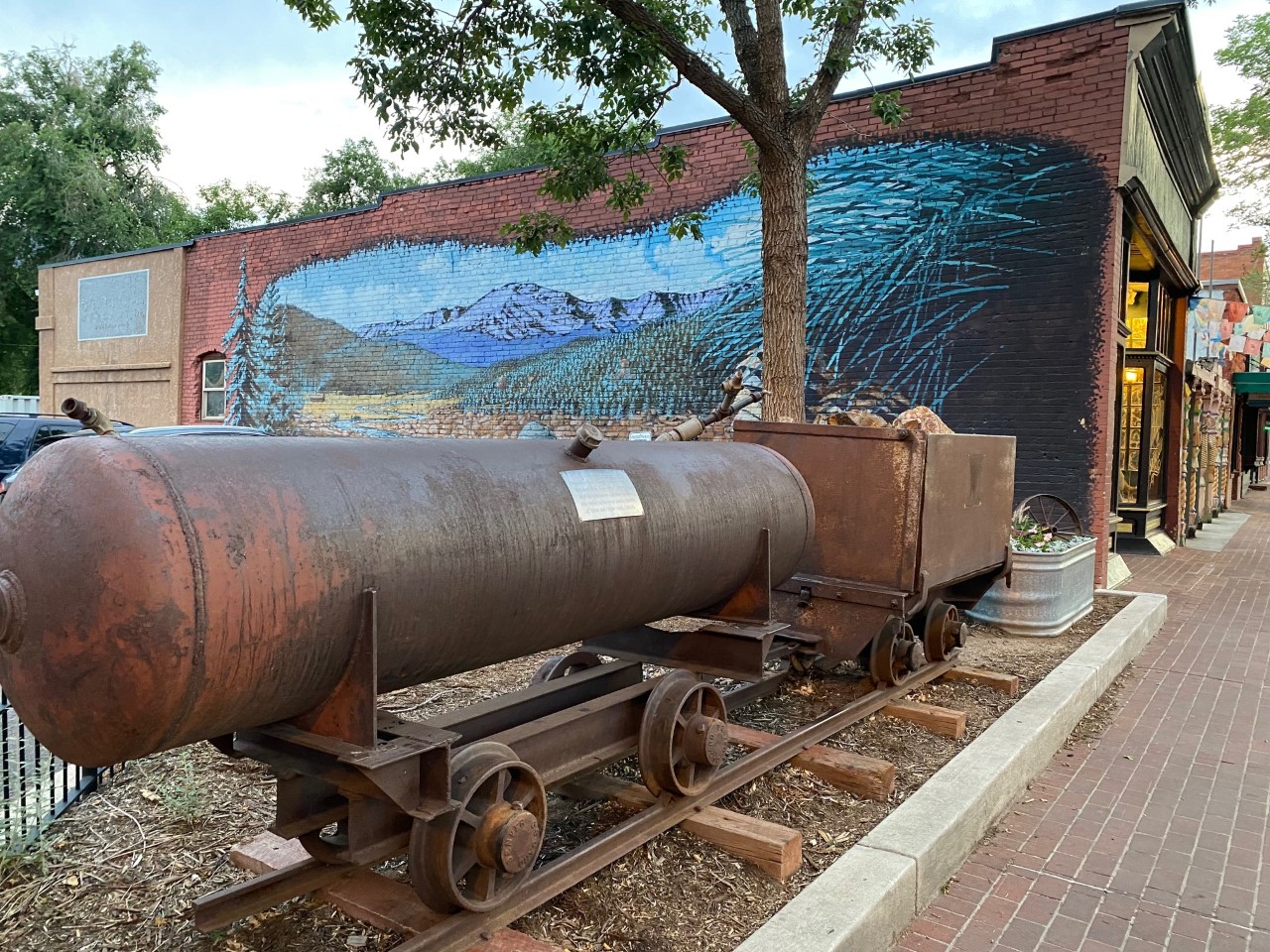 Mural “Bear at Mountain Strea” with Old Mining Car in Old Colorado City. Oops can’t see bear in this picture.