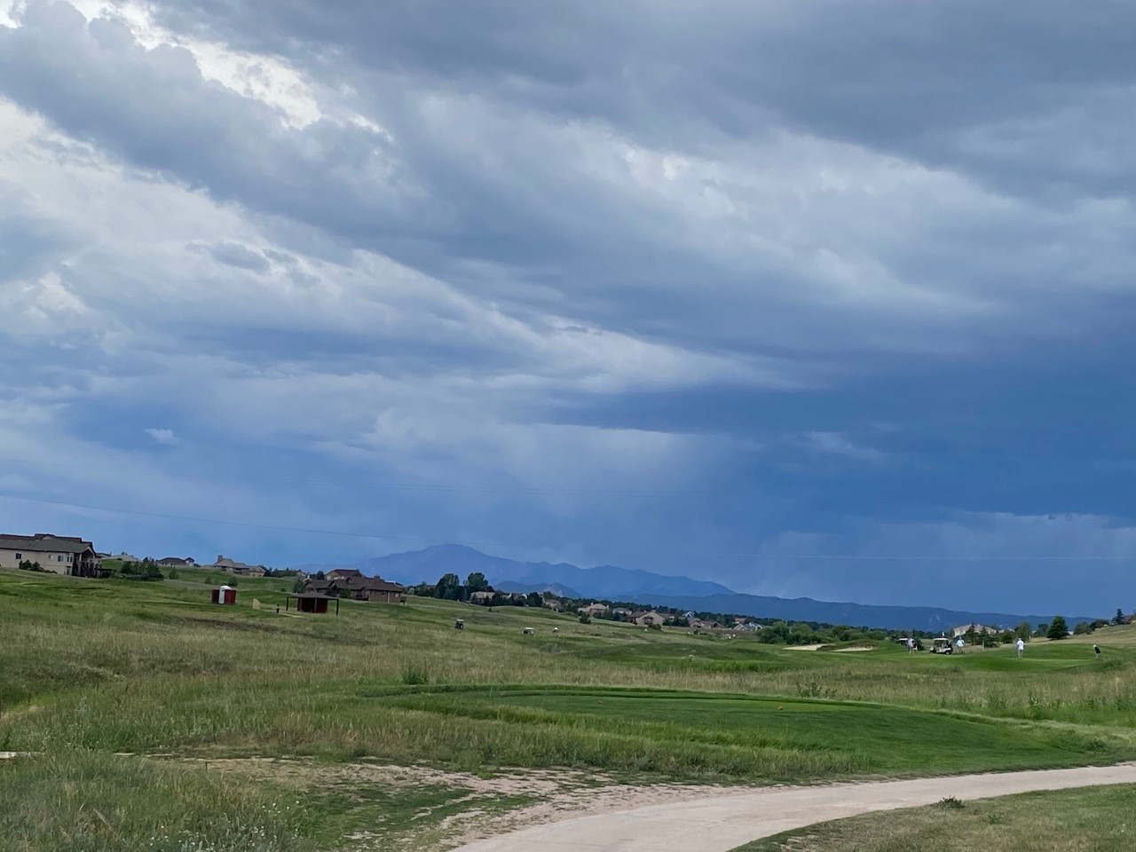 King’s Deer Golf Club as a storm arrives with views of Pike’s Peak and Front Range.