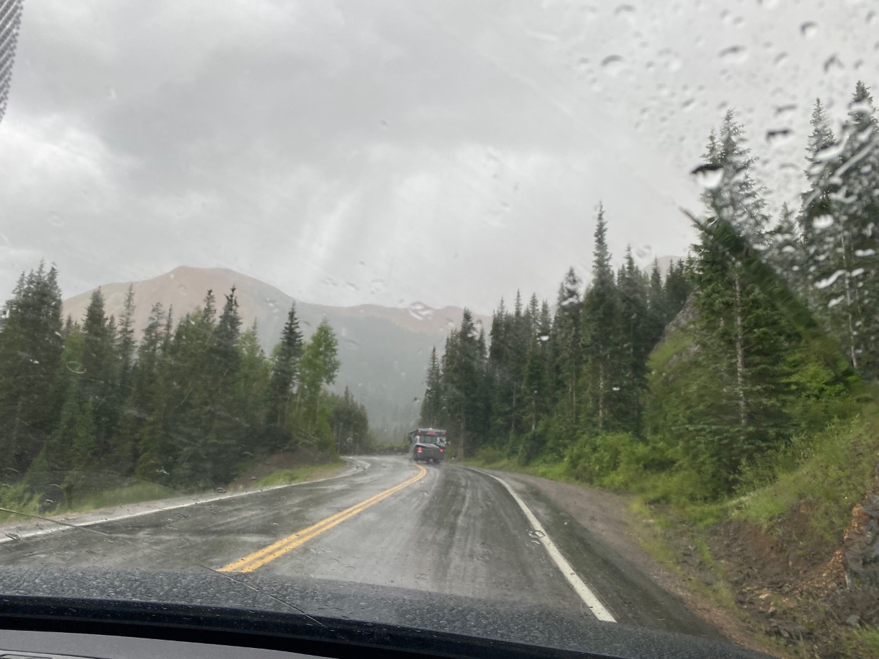 Here comes the rain! Wet slick roads on the Million Dollar Highway.