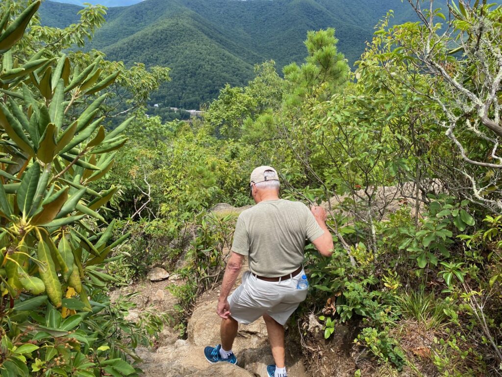 Richard begins the descent over the rocks.