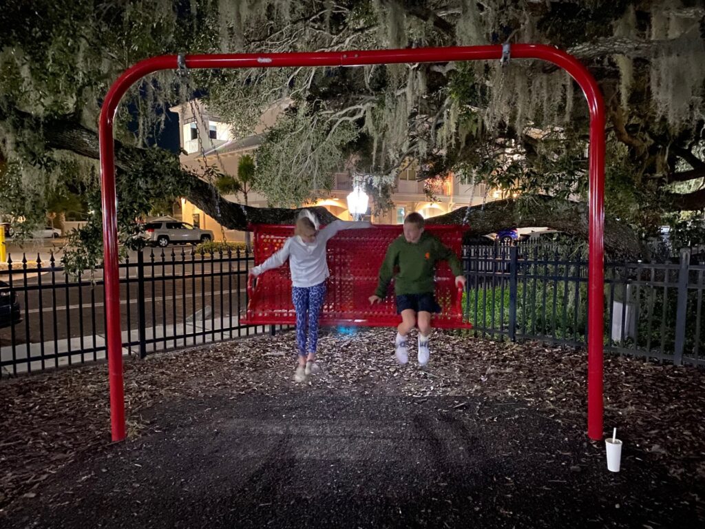 Swinging under the branches of the Baranoff Oak tree.