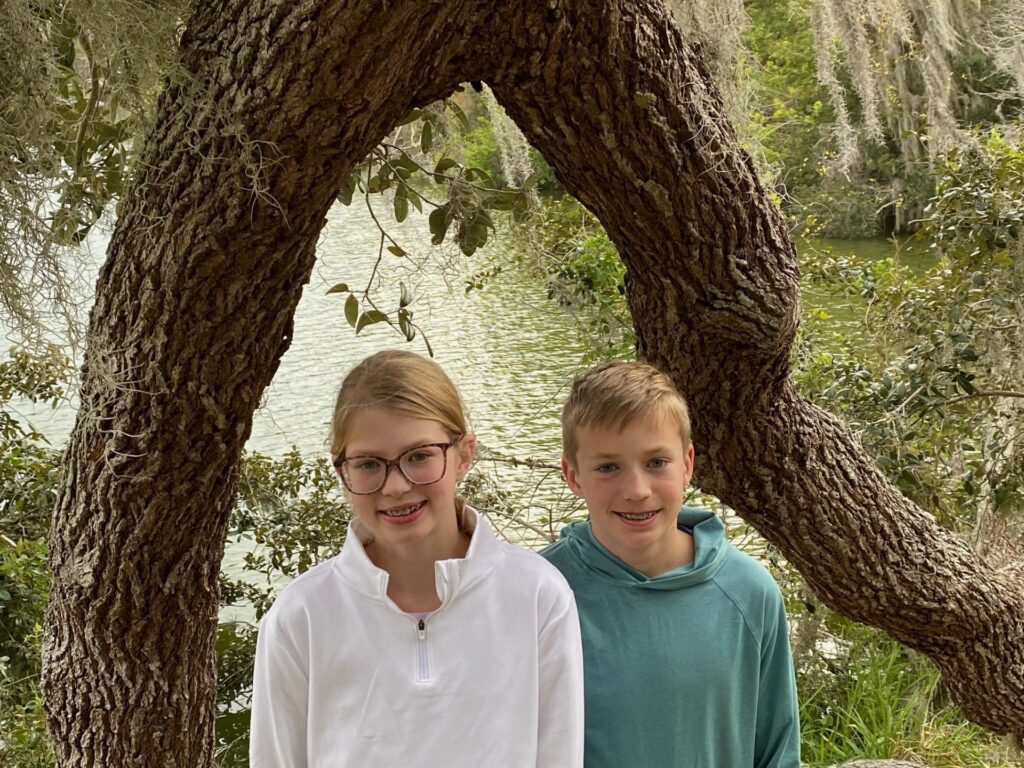 Lucy & Louis under the tree branch.