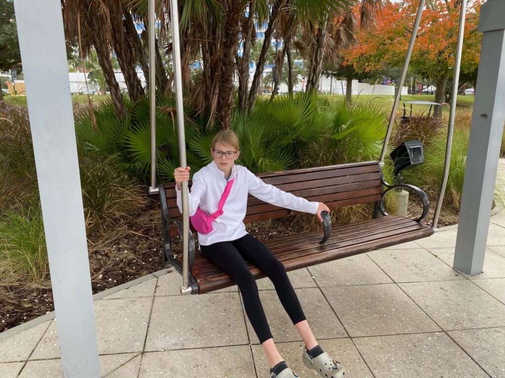 Lucy relaxes in a swing along the Tampa Riverwalk.