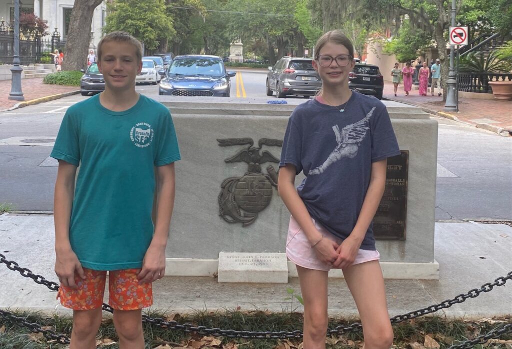 Louis & Lucy posing at the Marine Corp Monument in Forsyth Park.